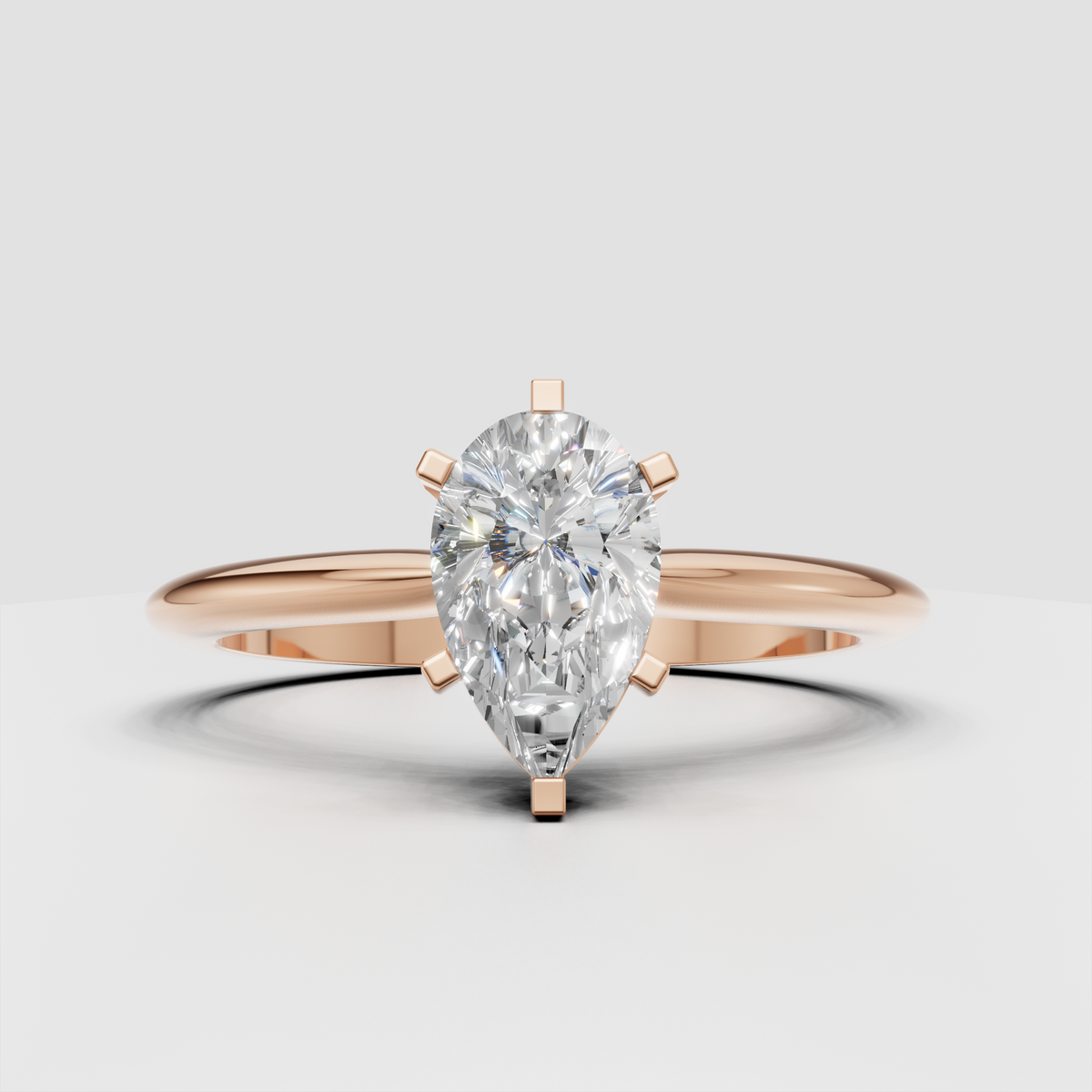Close-up pear shaped diamond engagement ring with prongs