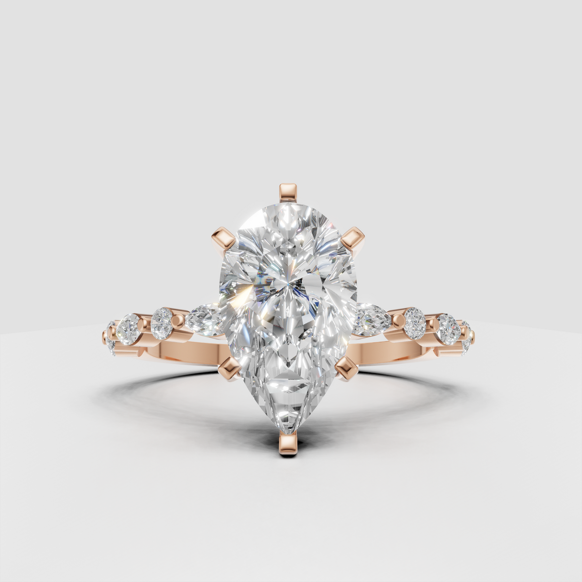 Marquise diamond engagement ring with round and marquise side stones