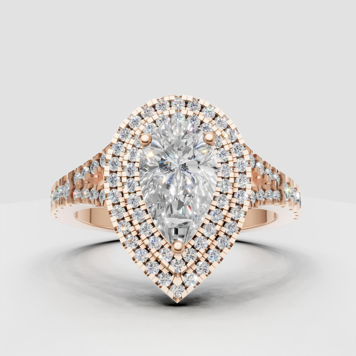 Brilliant pear diamond ring with triple halo and pave shank