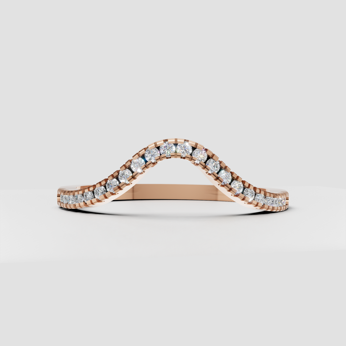 Side view of round diamond contour wedding band