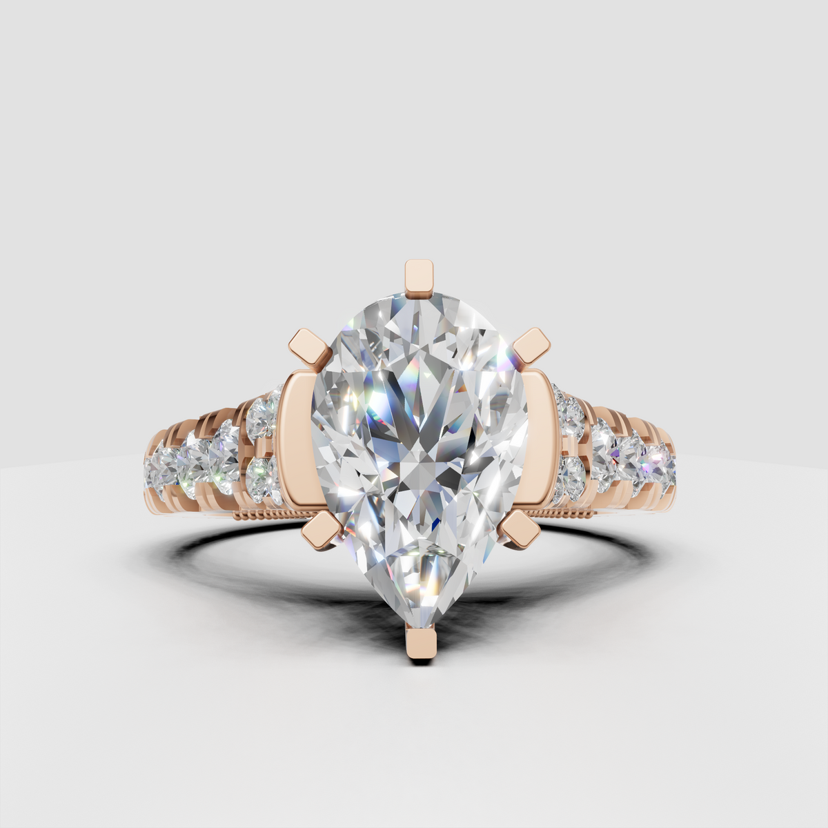 Classic pear cut diamond bridal ring with intricate detailing