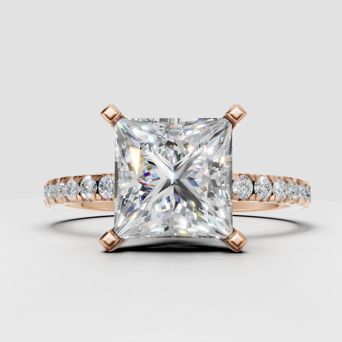 Yellow gold princess cut diamond ring with diamond-accented shoulders