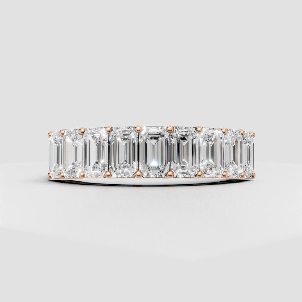Full eternity ring with elongated emerald cut diamonds