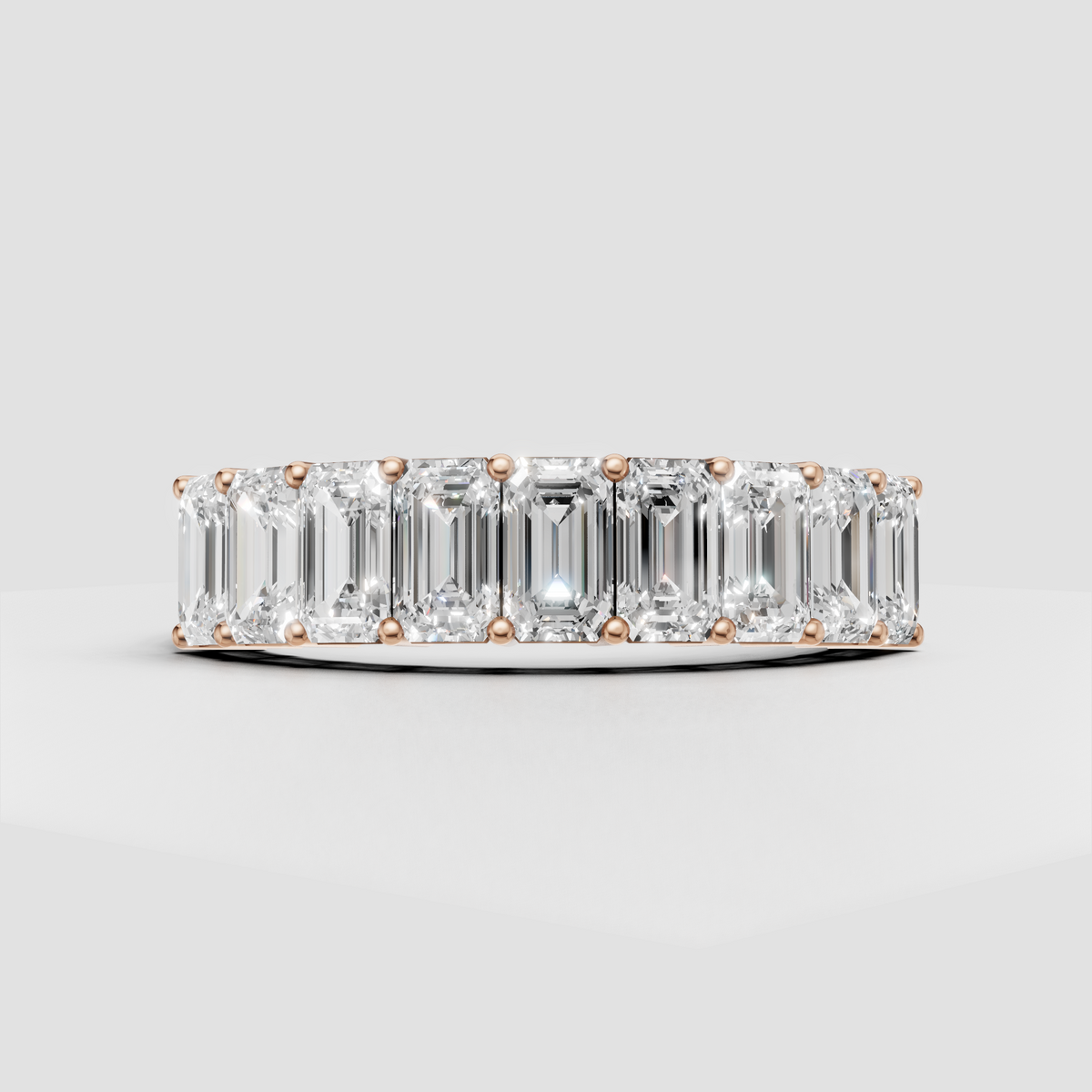 Full eternity ring with elongated emerald cut diamonds