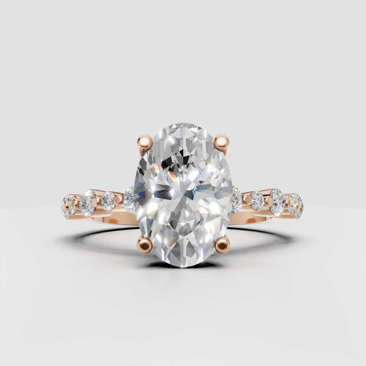 Polished yellow gold oval engagement ring with diamond accents