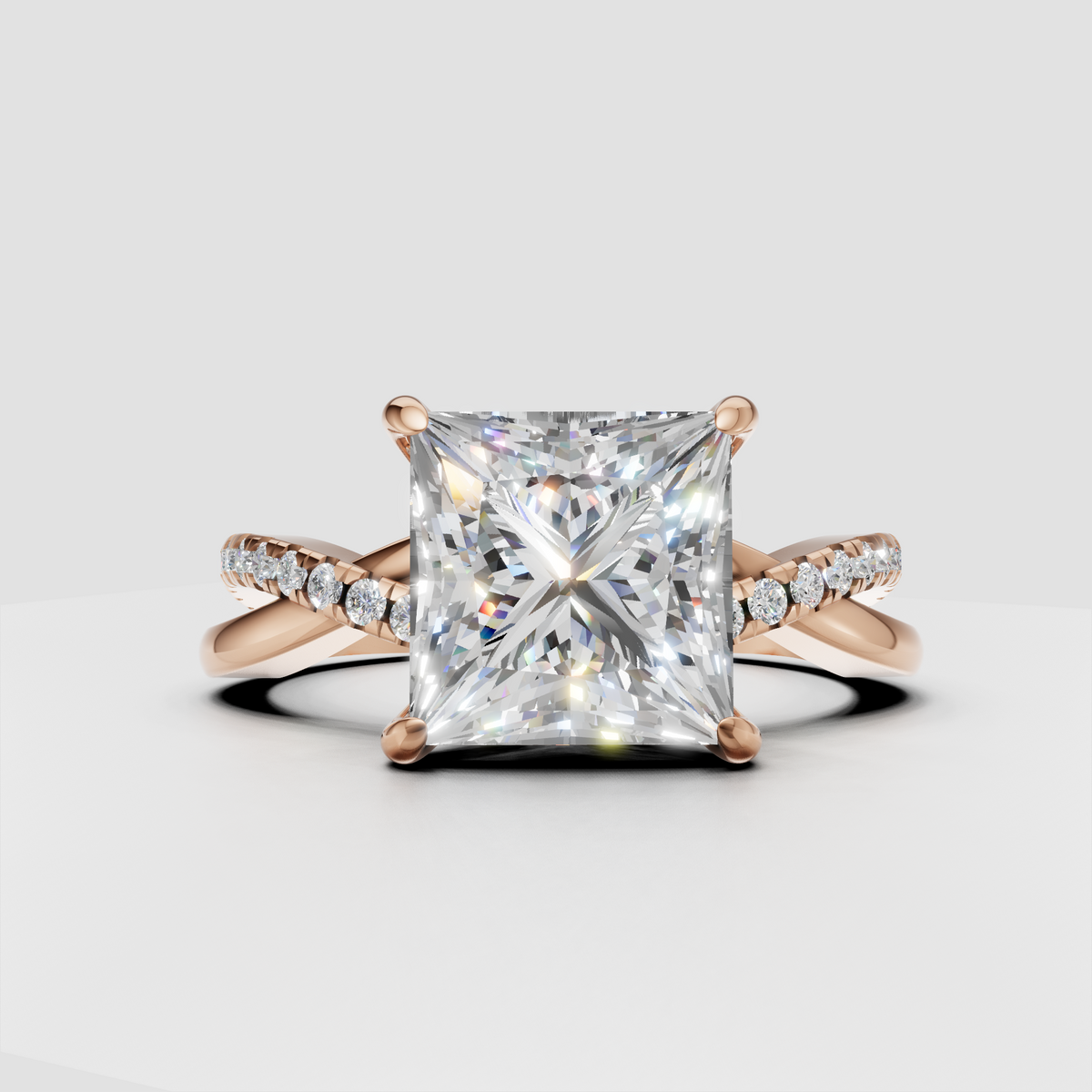 Princess cut center diamond in a four-prong crossover setting