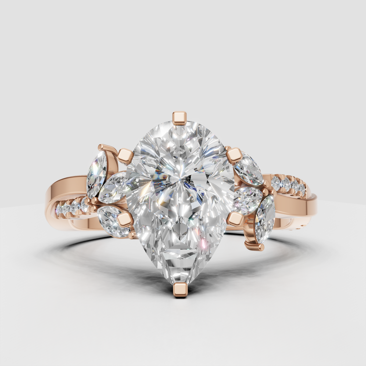 Pear diamond engagement ring with graduated round shoulder diamonds