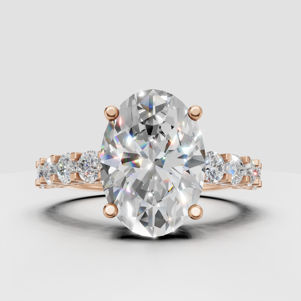 Pear diamond engagement ring with split shank and pavé stones