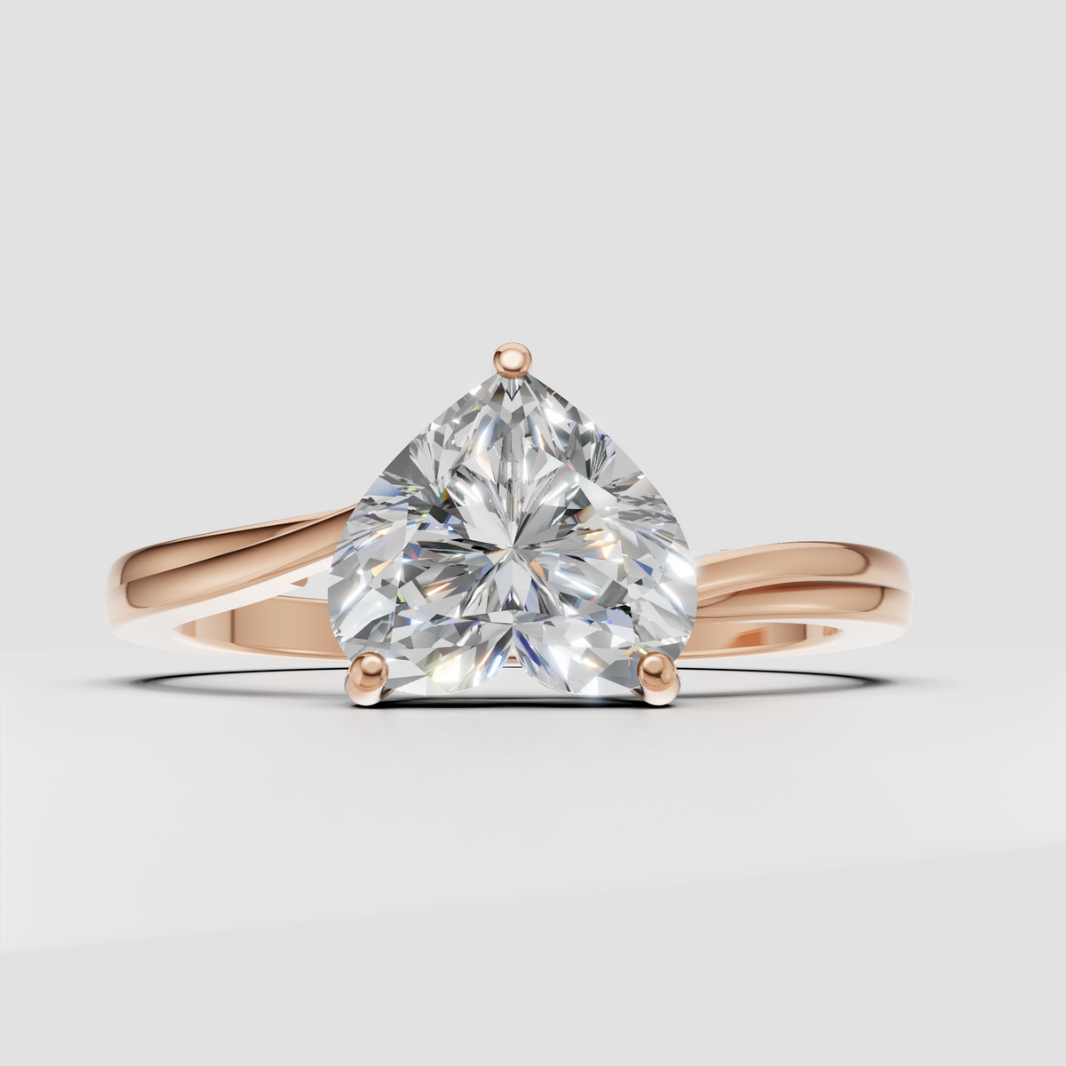 Modern heart shaped diamond engagement ring with refined four-prong setting