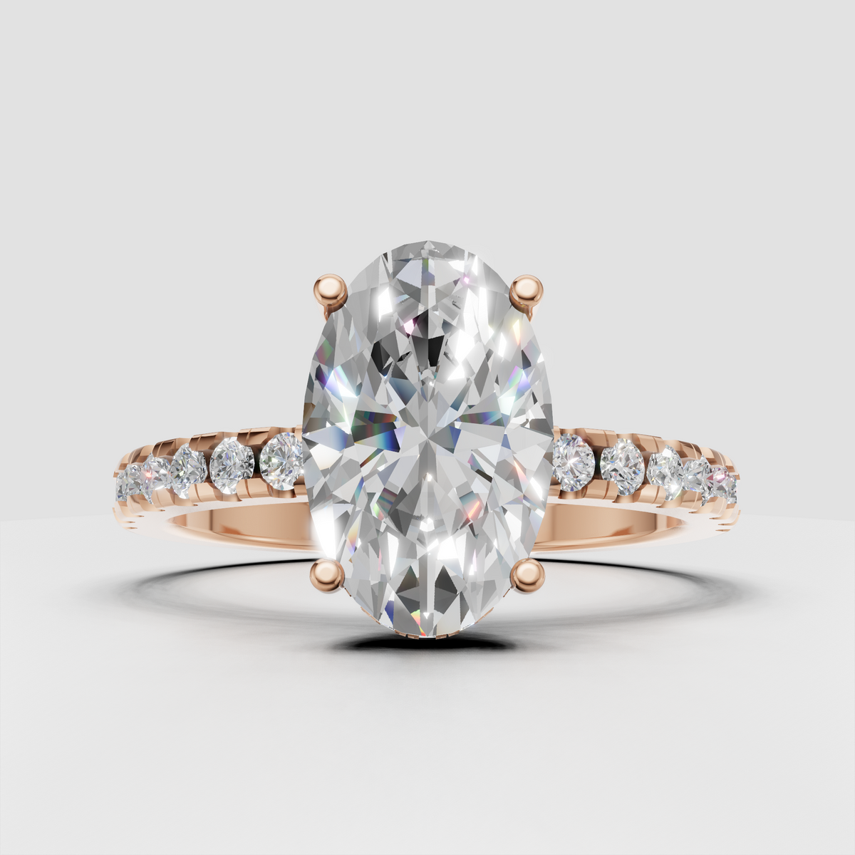 Pear shaped center diamond secured by prongs with pavé-set shoulder stones