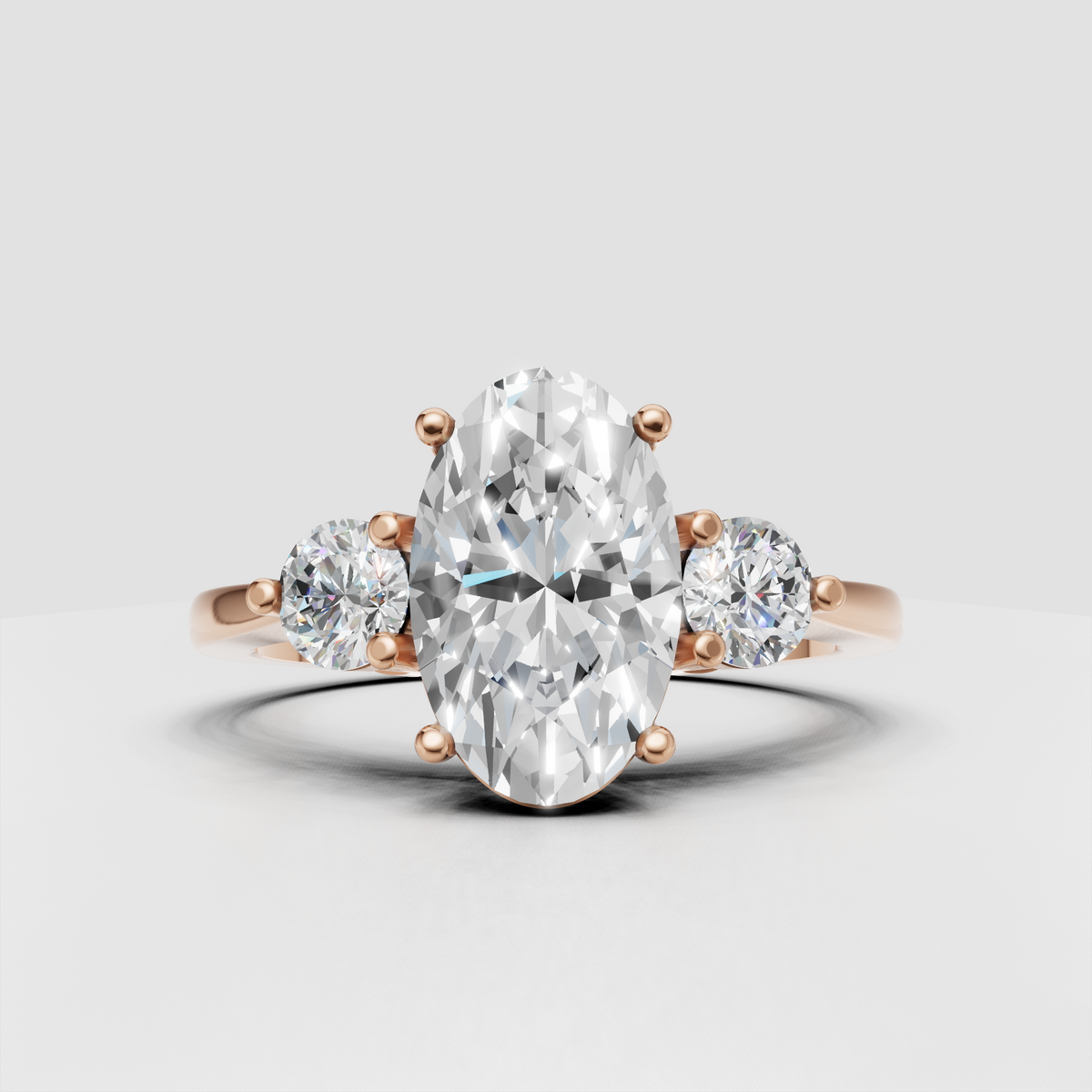 Timeless oval diamond three stone engagement ring