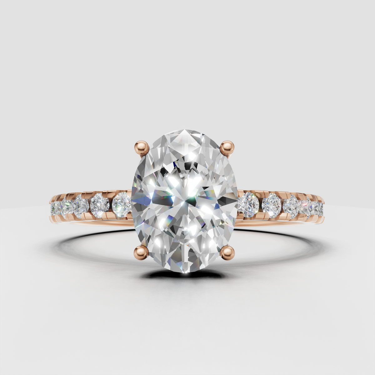 Oval diamond engagement ring with graduated pavé stones