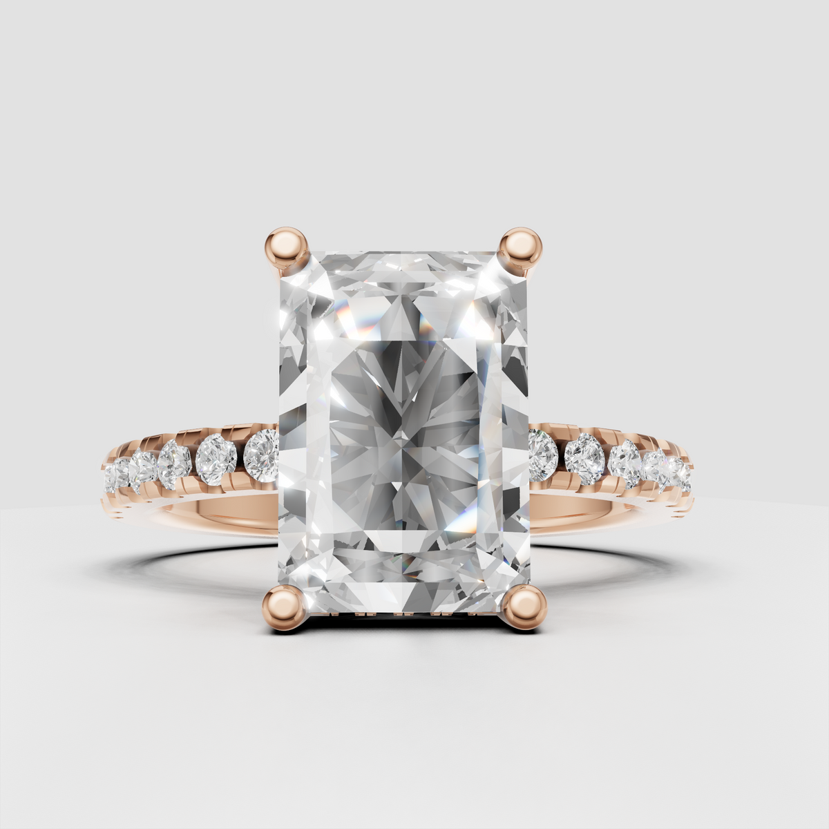 Radiant cut diamond ring viewed from the front with pavé detailing