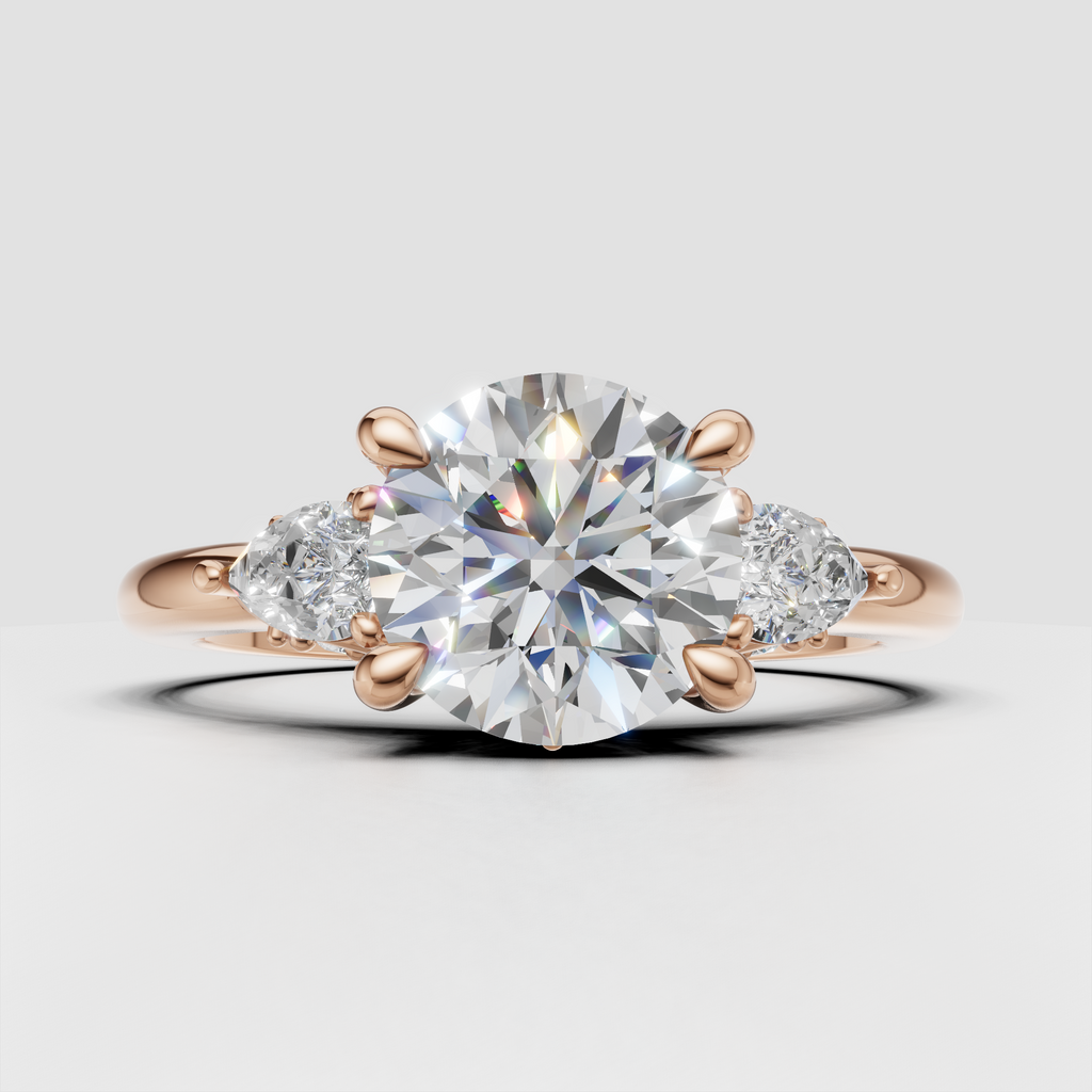Three stone round diamond ring with intricate leaf-inspired detailing