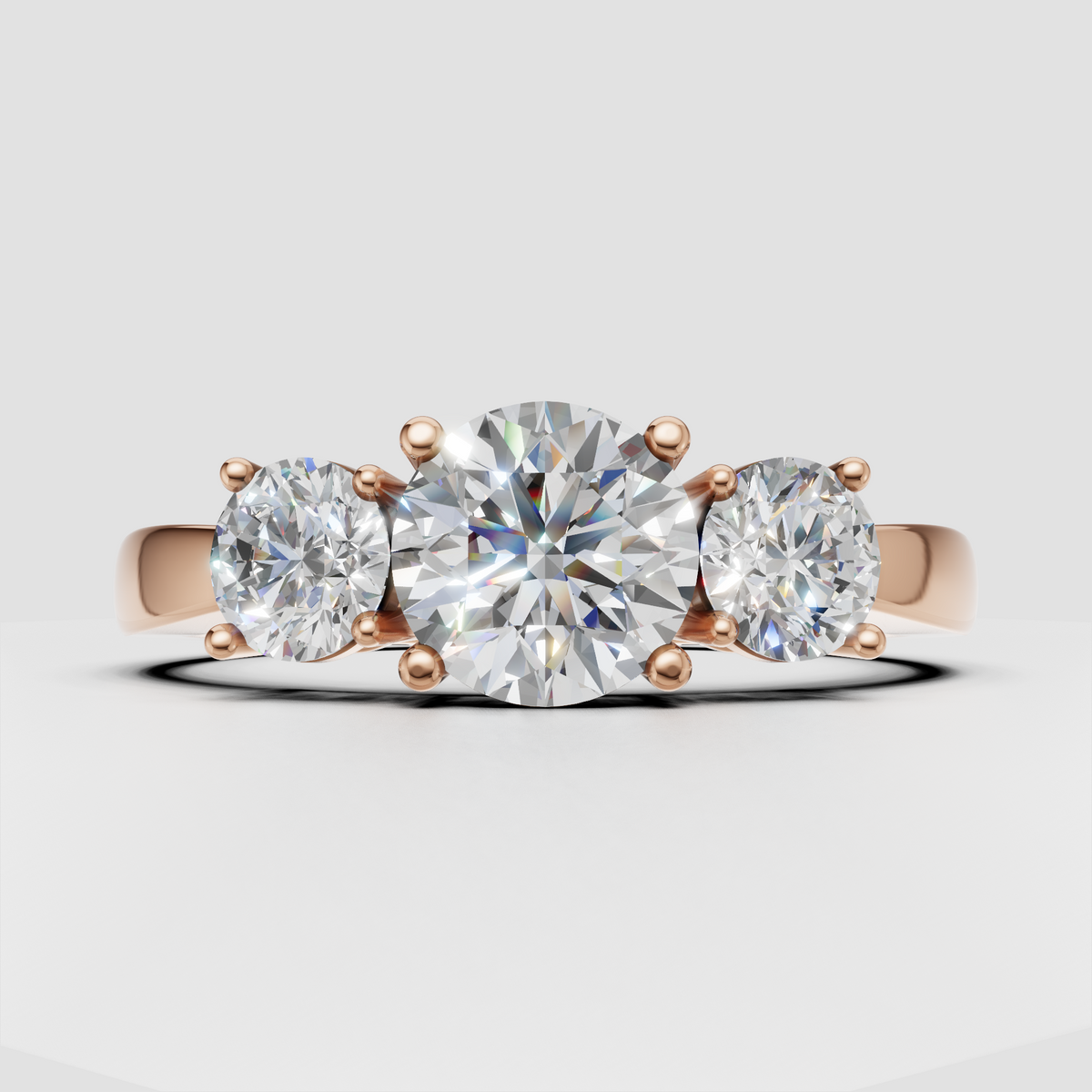 Yellow gold round Diamond ring with elevated three-stone setting