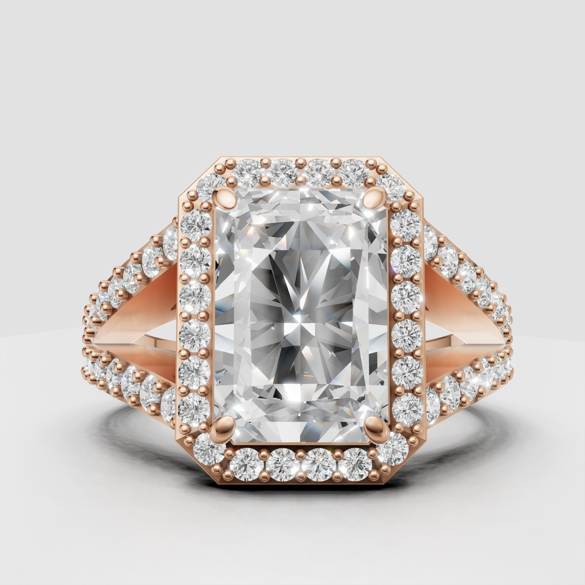 Detailed radiant halo engagement ring in polished gold