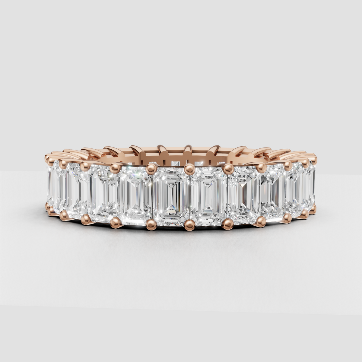Classic emerald cut diamond eternity ring in yellow gold