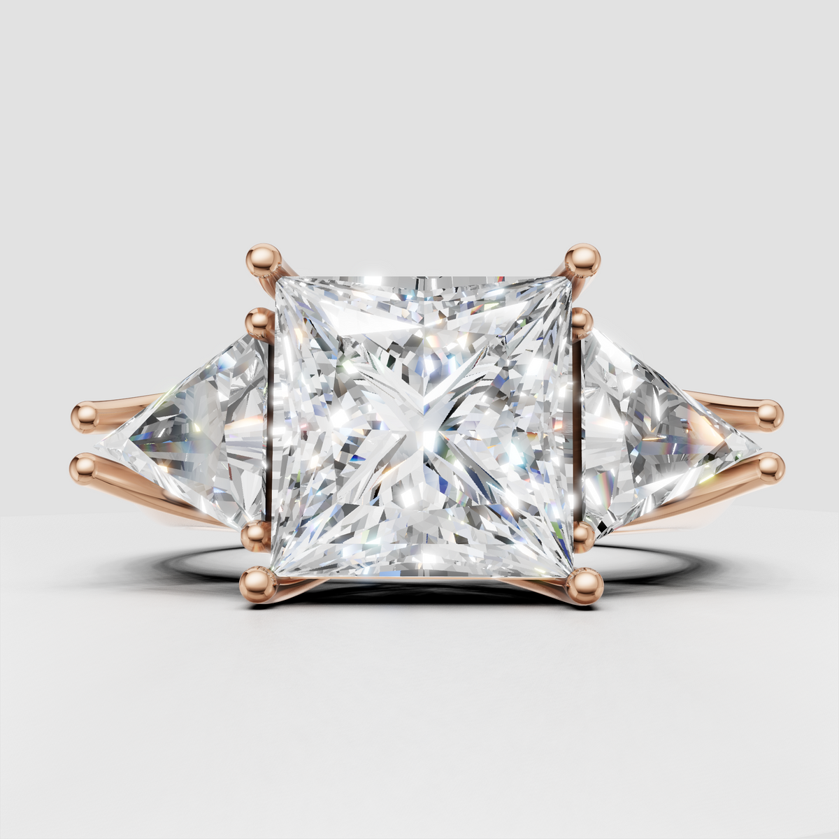 Elegant yellow gold three stone princess diamond engagement ring