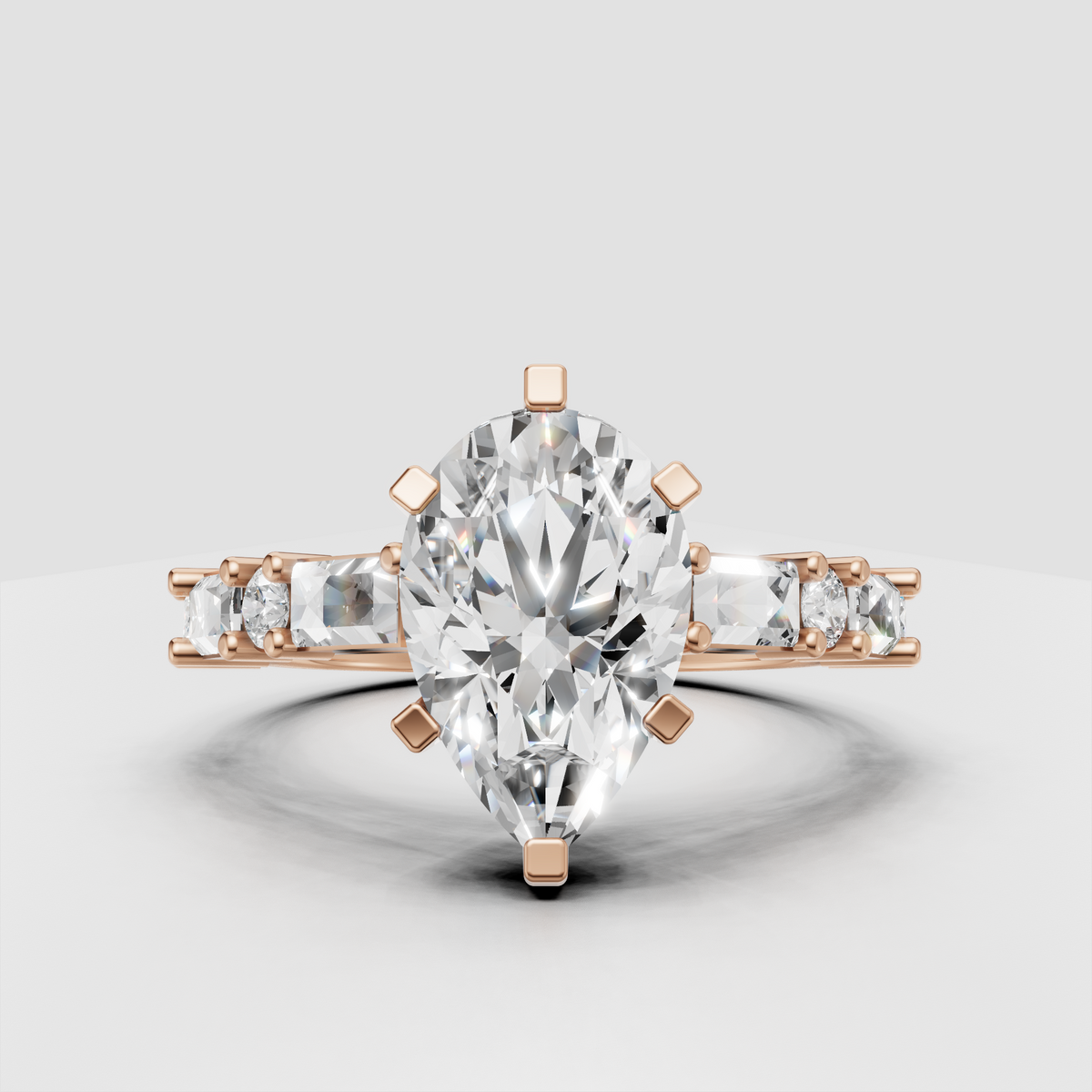 Pear shaped canter diamond with baguette accented shoulders