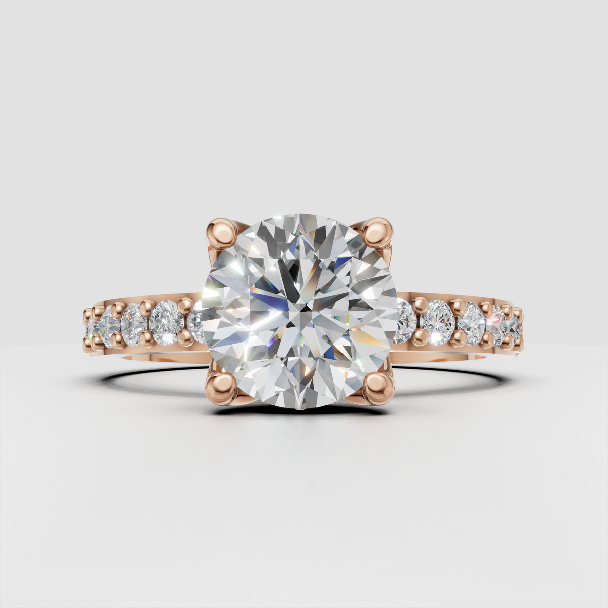 Round diamond engagement ring featuring floral-inspired open gallery