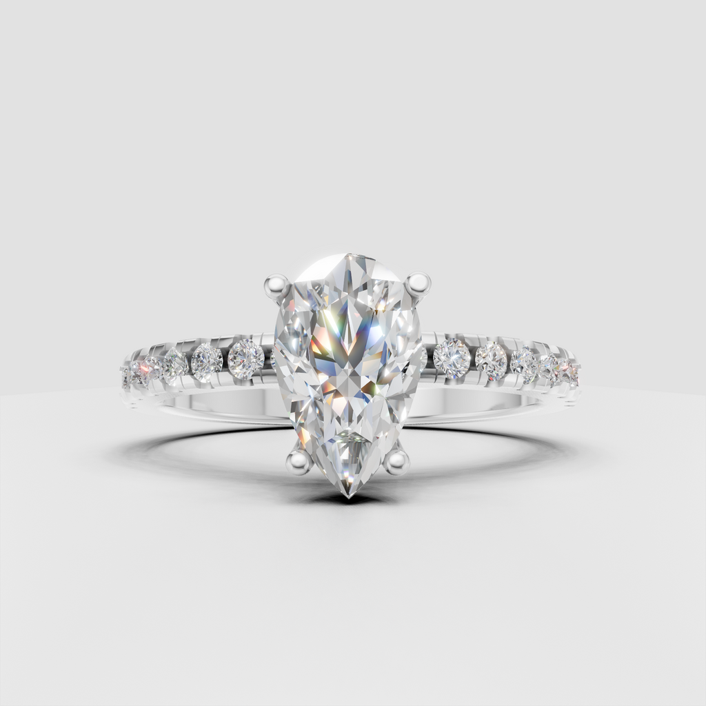 Pear diamond ring featuring a delicate hidden halo beneath the center