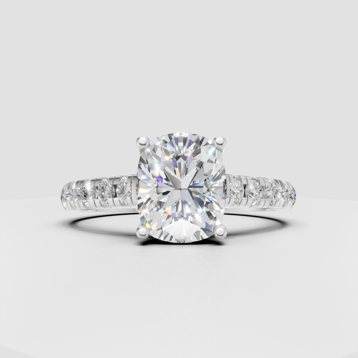 Cushion solitaire engagement ring with half pavé band
