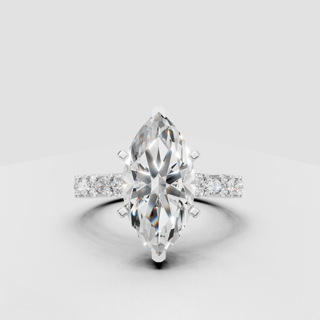 Marquise diamond ring featuring detailed pavé yellow gold shoulders