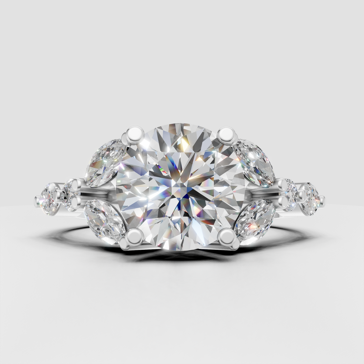 Yellow gold round diamond ring with marquise cluster side stones