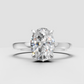Oval diamond ring featuring a delicate hidden halo of round stones
