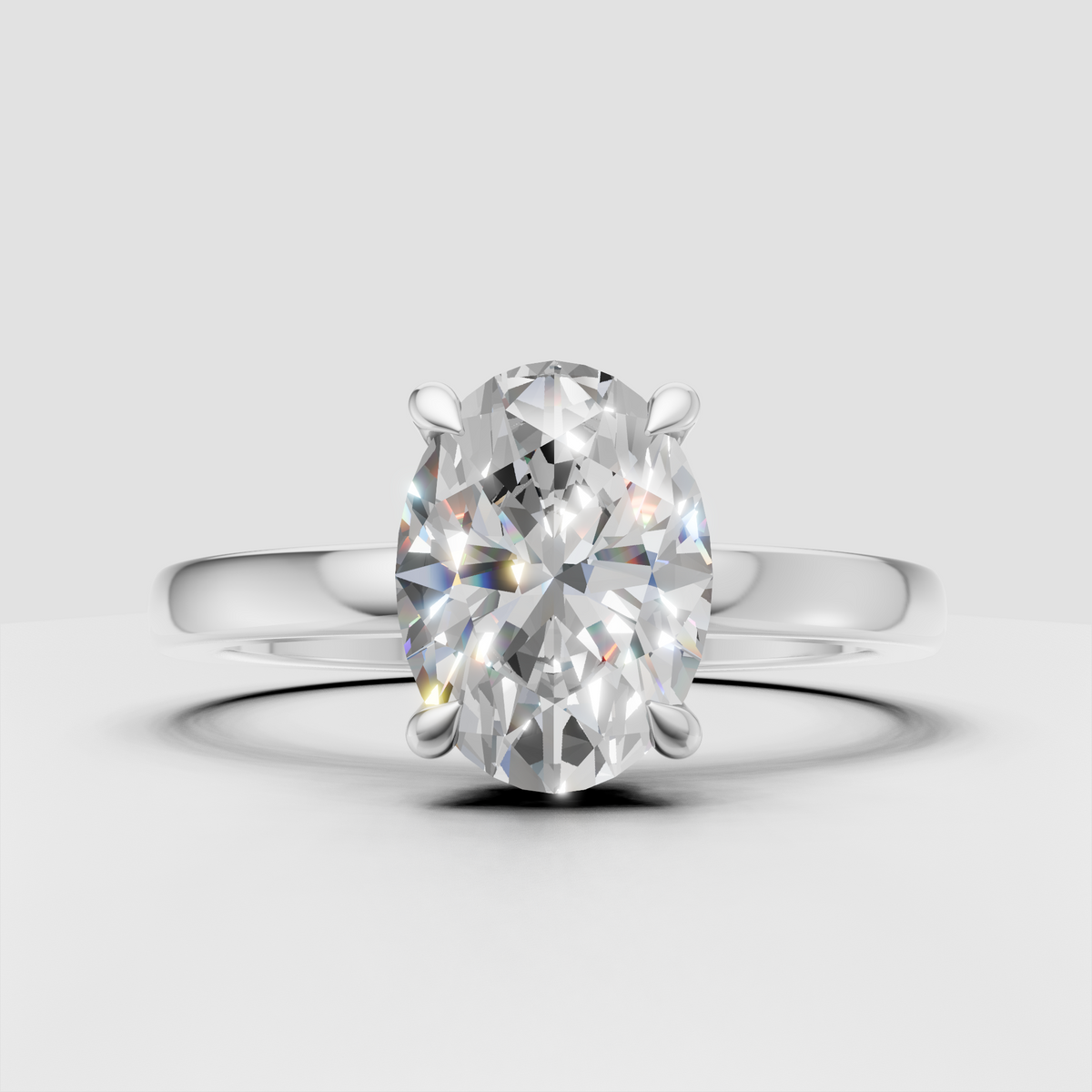 Oval diamond ring featuring a delicate hidden halo of round stones
