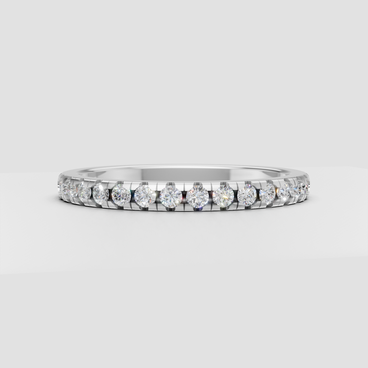 Round brilliant eternity band featuring shared prongs