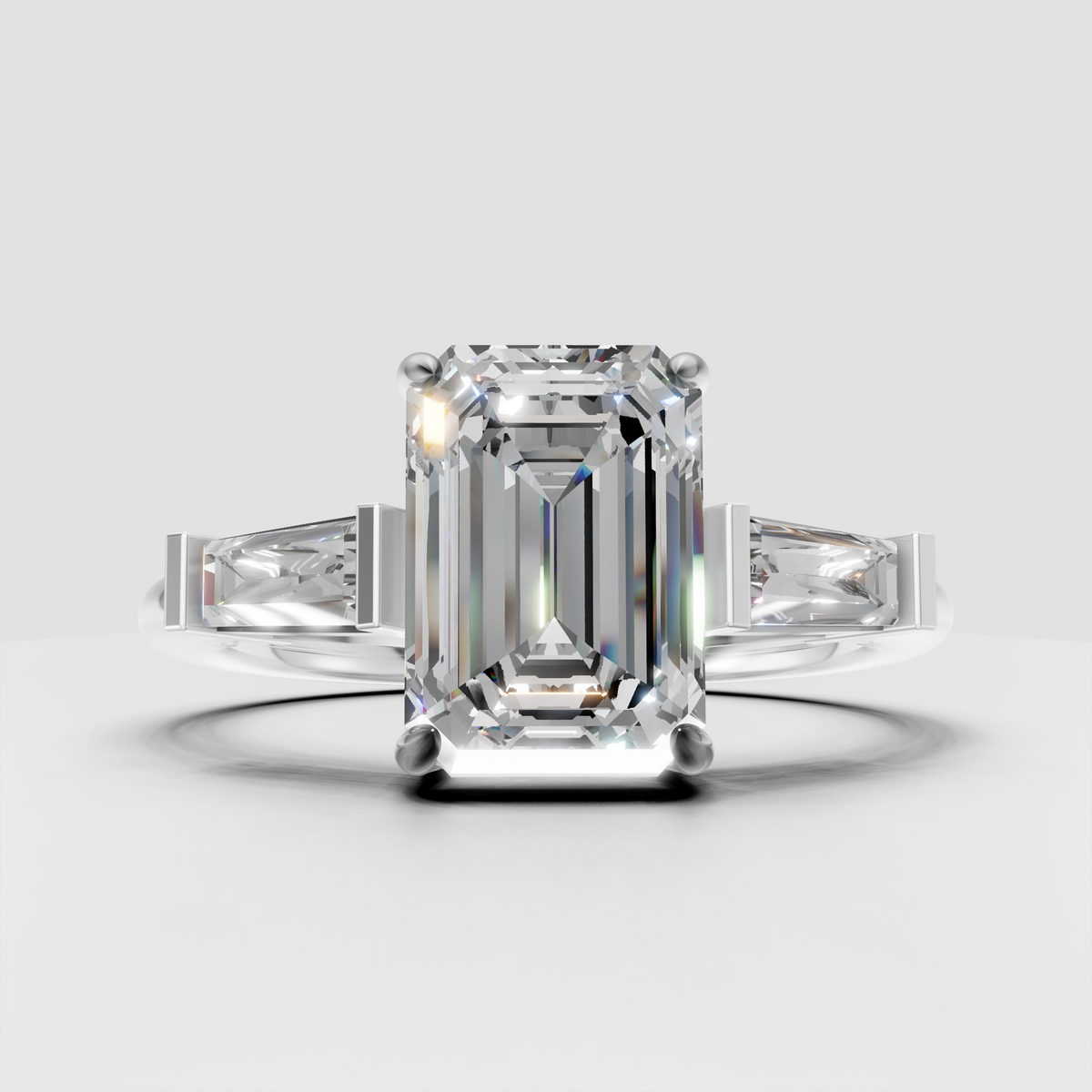 Modern emerald cut diamond three stone ring with geometric baguette accents
