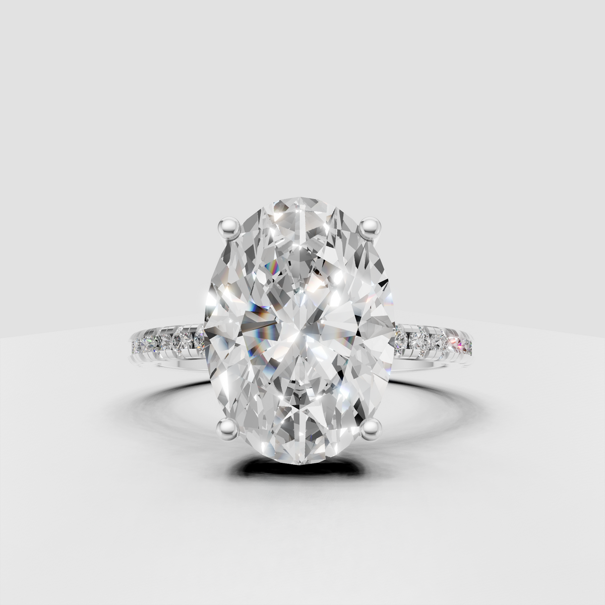 Elegant oval diamond ring with diamond accented shoulders