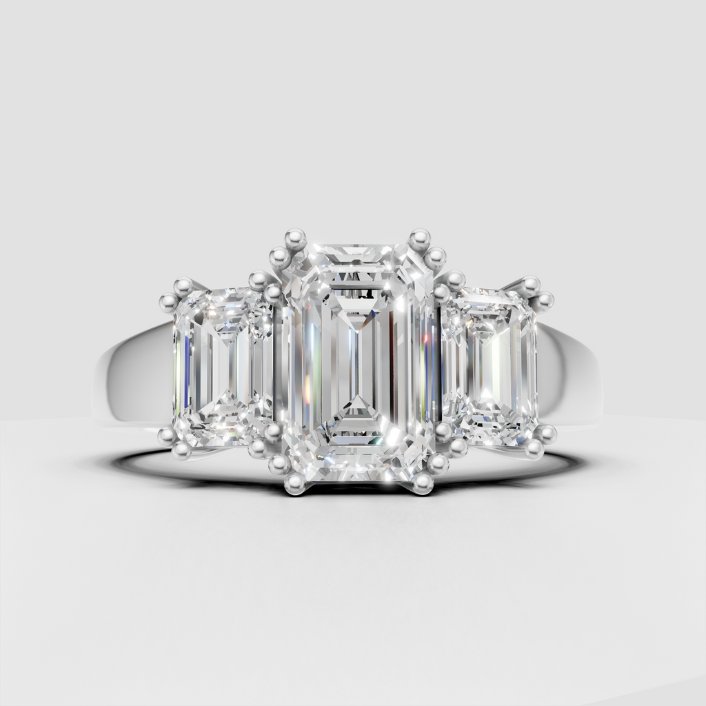 Emerald cut Diamond three stone ring with prong setting