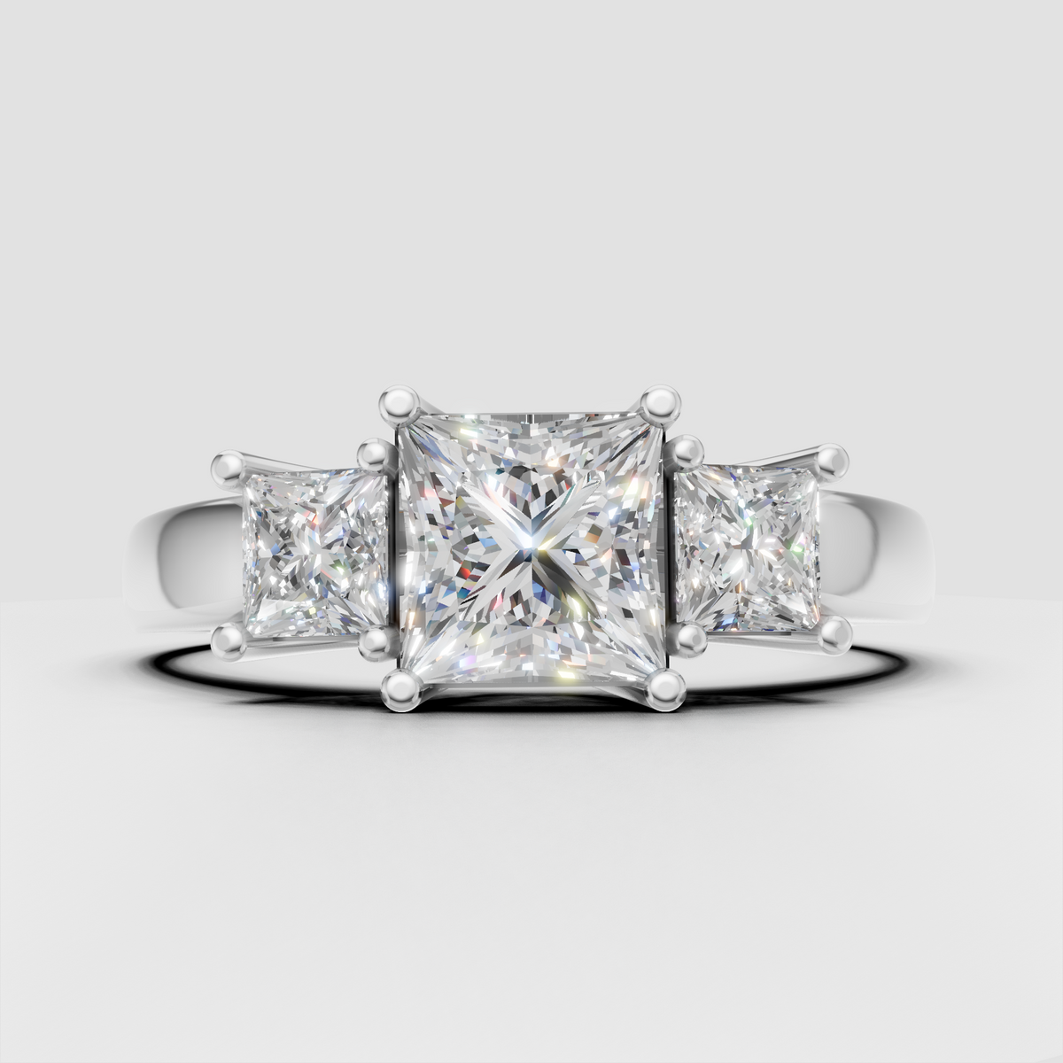 Princess diamond three stone ring with sculpted prongs