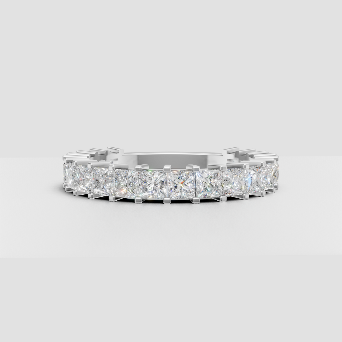 Cushion shaped diamond band with polished gold setting