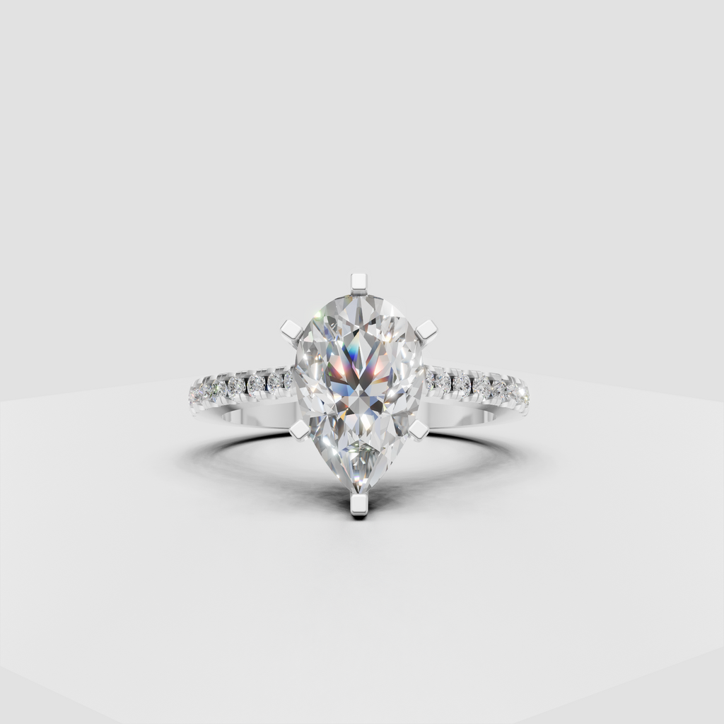 Pear cut diamond ring in polished yellow gold with cathedral setting