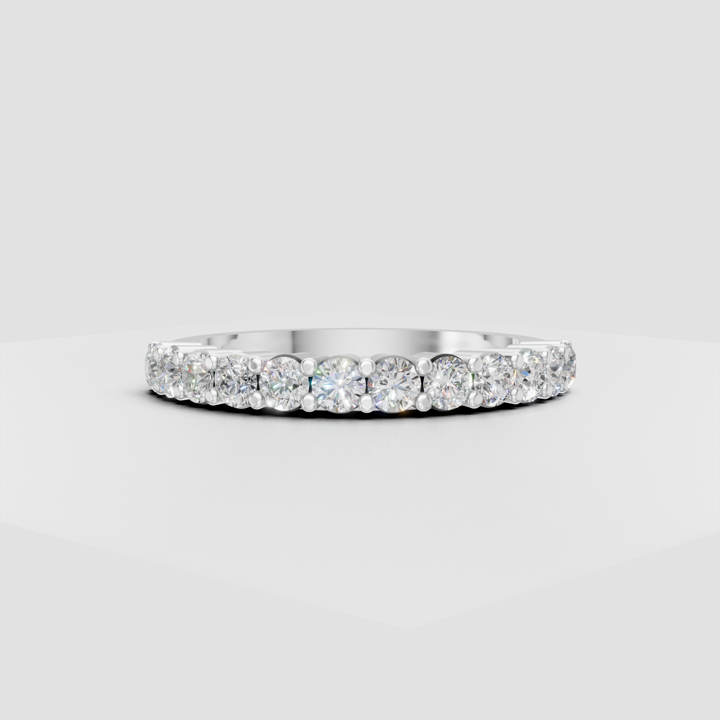 Polished yellow gold eternity ring with round diamonds in bead-style settings