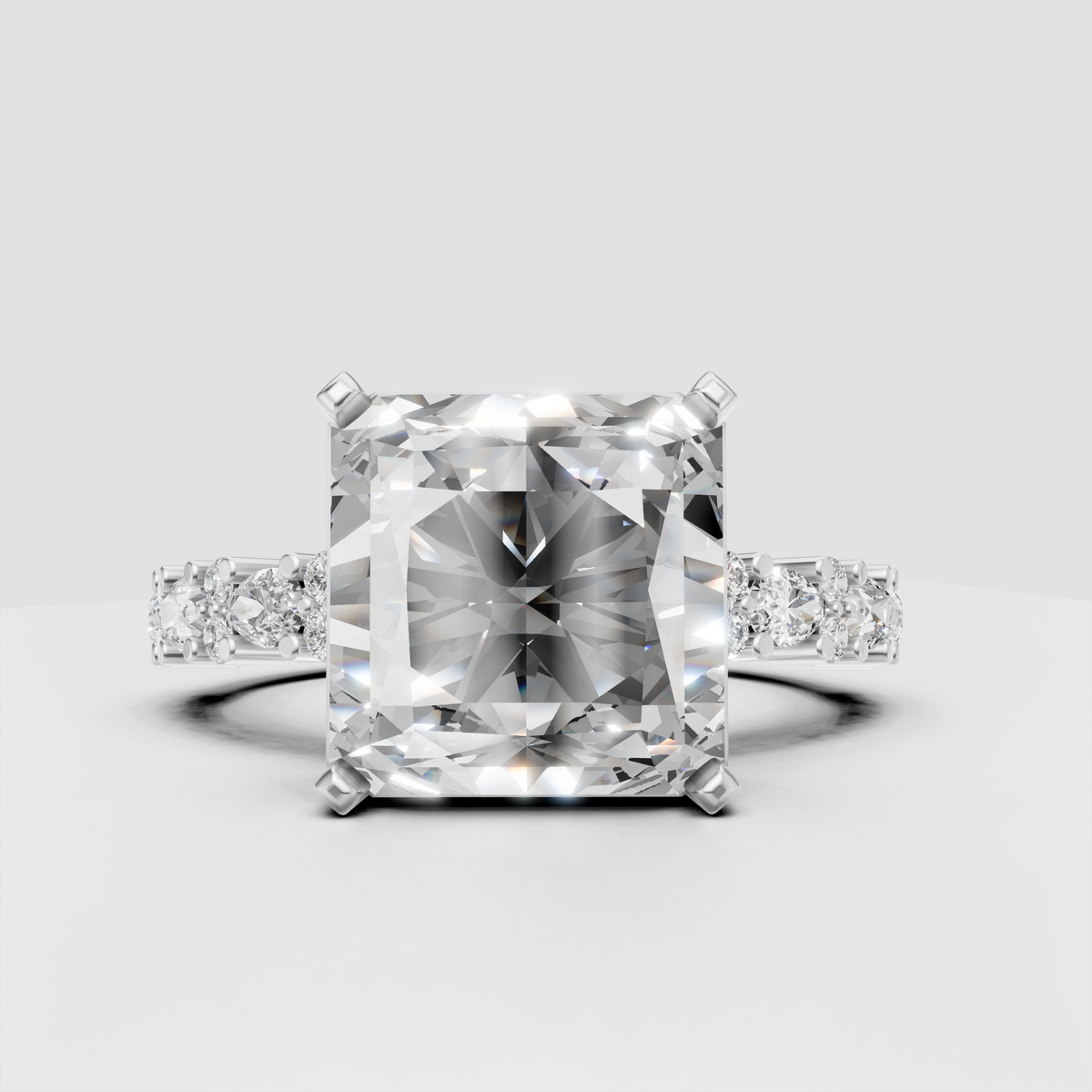 Princess cut center stone engagement ring with diamond accented shoulders