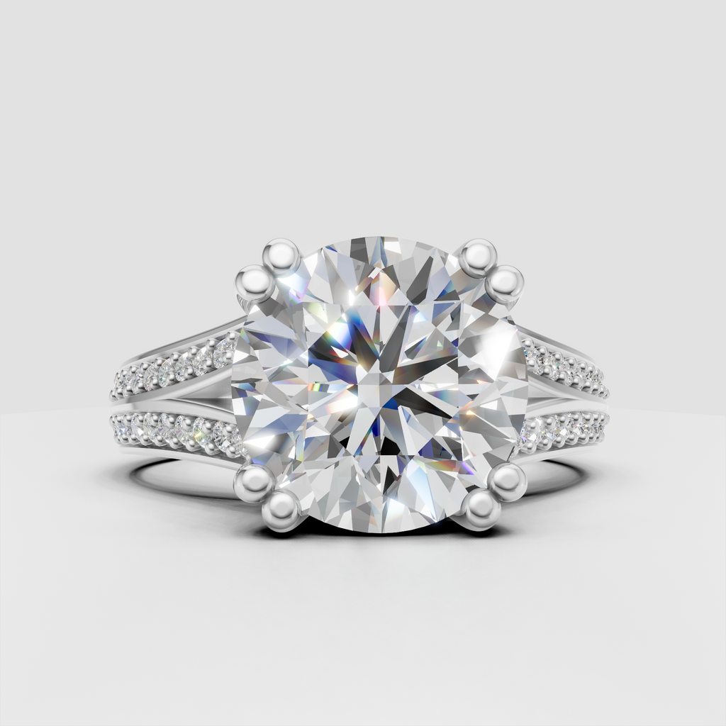 Pavé split shank round diamond engagement ring in polished gold
