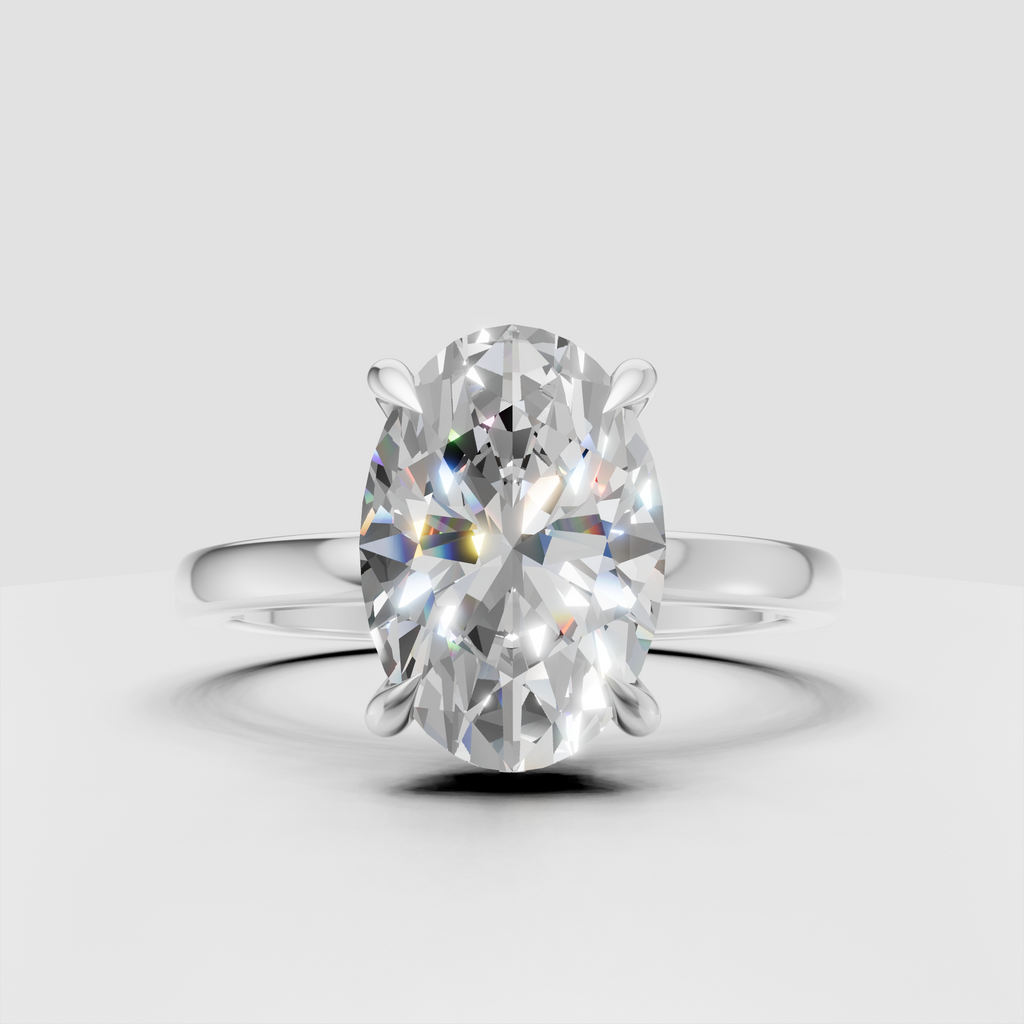 Oval center diamond four-prong engagement ring
