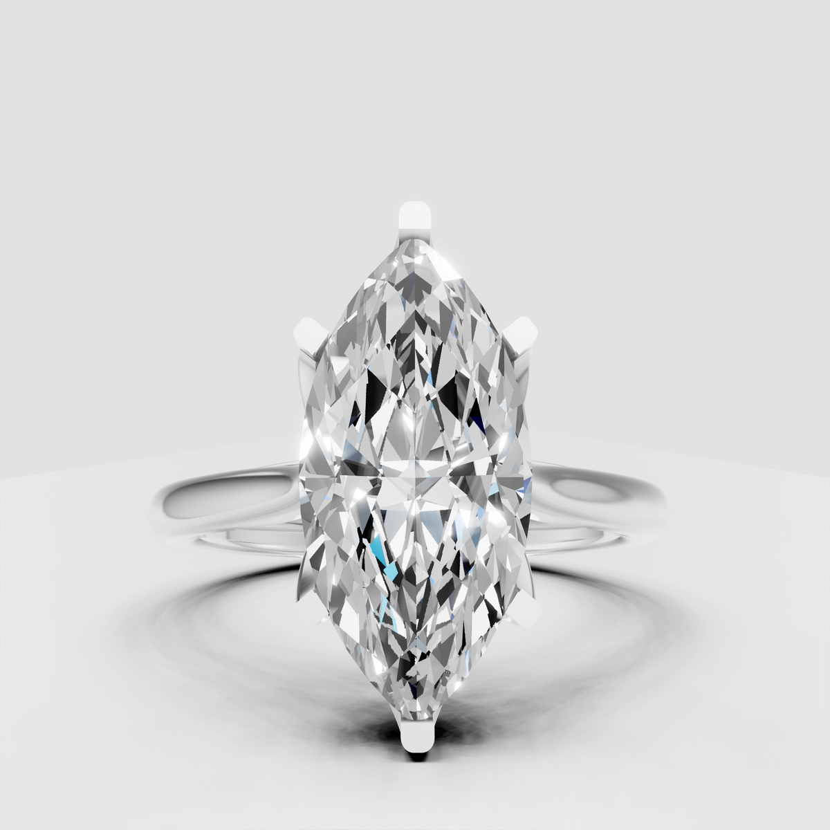 Gold marquise diamond ring featuring sculptural split shank