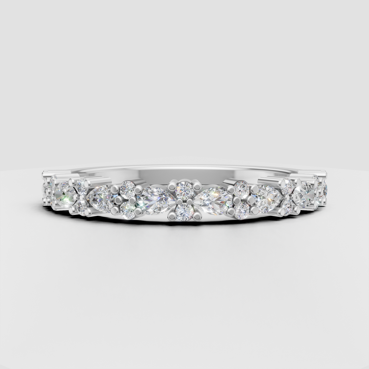 Half eternity round and pear diamond ring with polished gold band