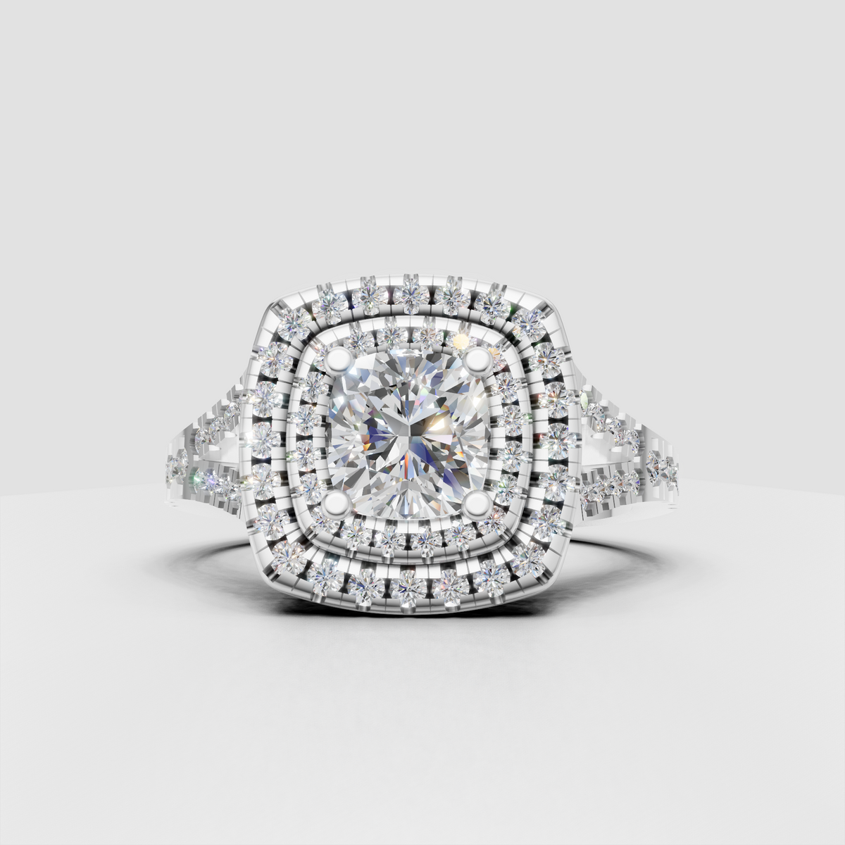 Cushion cut canter diamond with round diamond triple halo