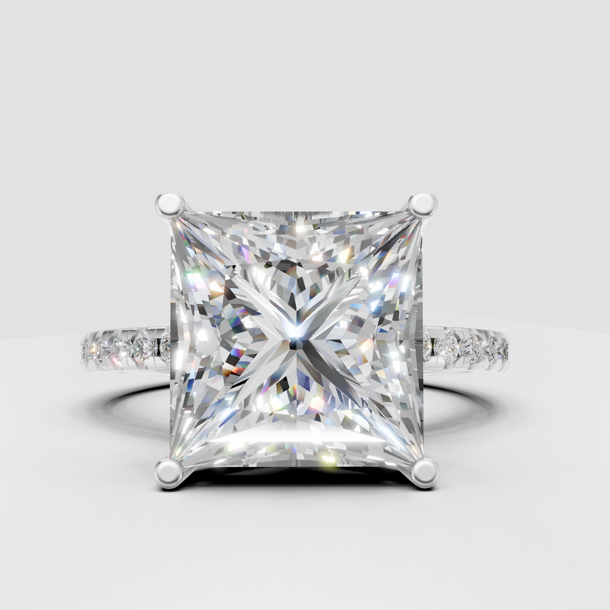 Modern princess cut diamond ring with cathedral gallery and hidden halo accents.