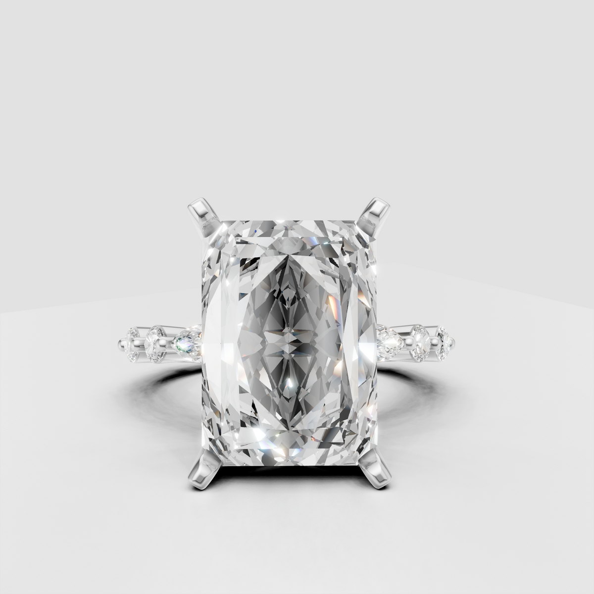Four-prong radiant diamond ring with diamond-accented shoulders in yellow gold