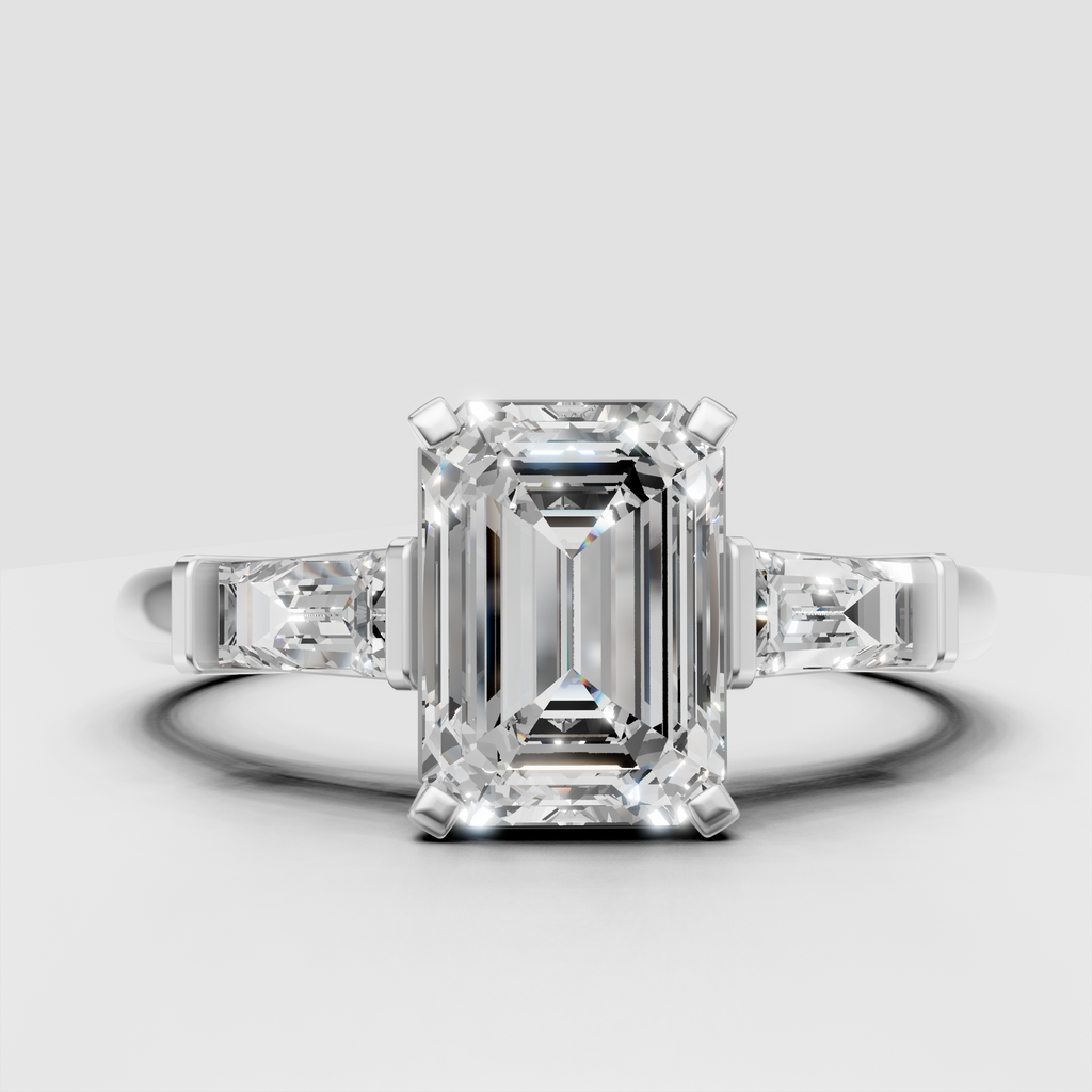 Yellow gold emerald cut ring with baguette shoulder stones