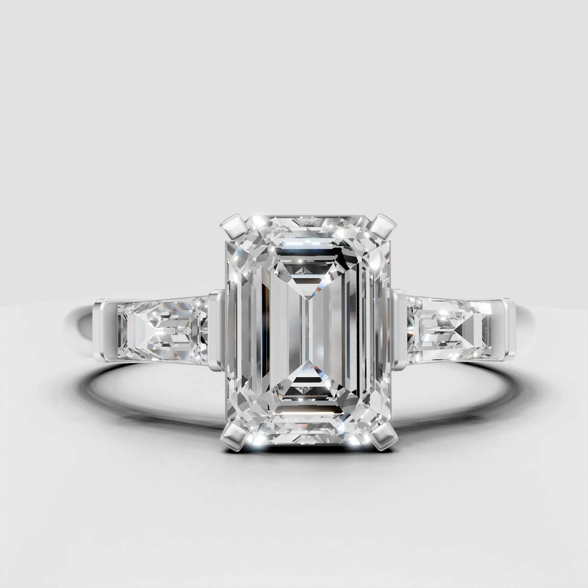 Yellow gold emerald cut ring with baguette shoulder stones