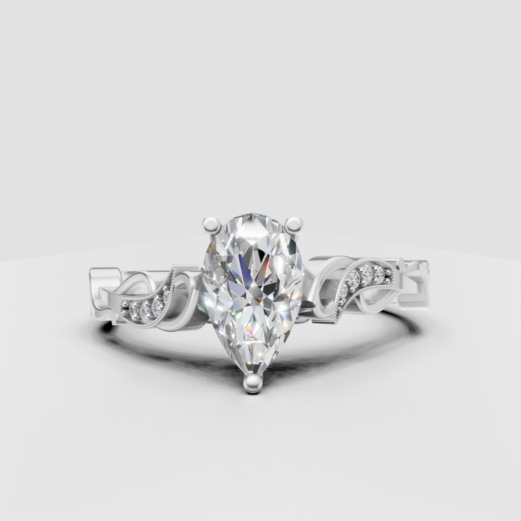 Pear shaped diamond ring with intricate antique inspired shoulders