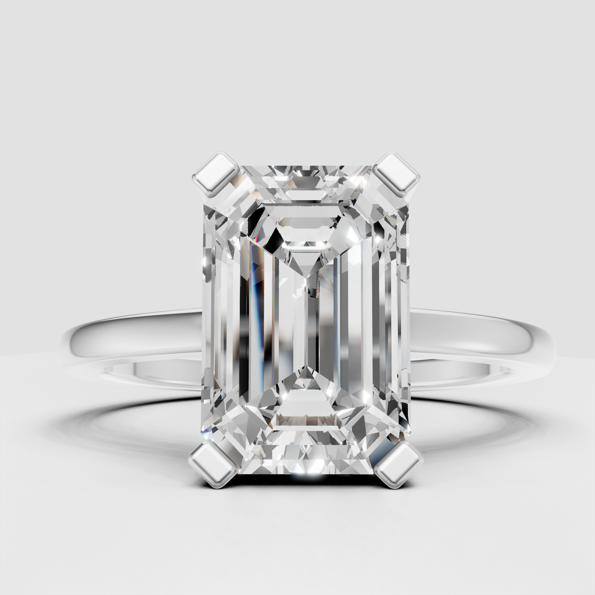 Yellow gold emerald cut solitaire ring